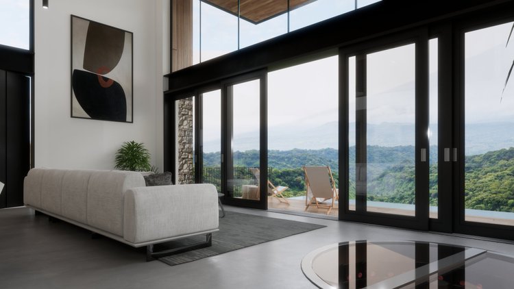 Modern living room with large glass sliding doors leading to a balcony with landscape view, white sofa, abstract wall art, indoor plant, gray rug, and a round glass coffee table.