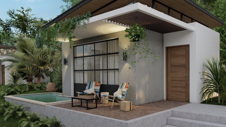 Modern house exterior with outdoor seating area featuring two colorful lounge chairs, a small wooden table, and lush greenery including palm trees and hanging plants.