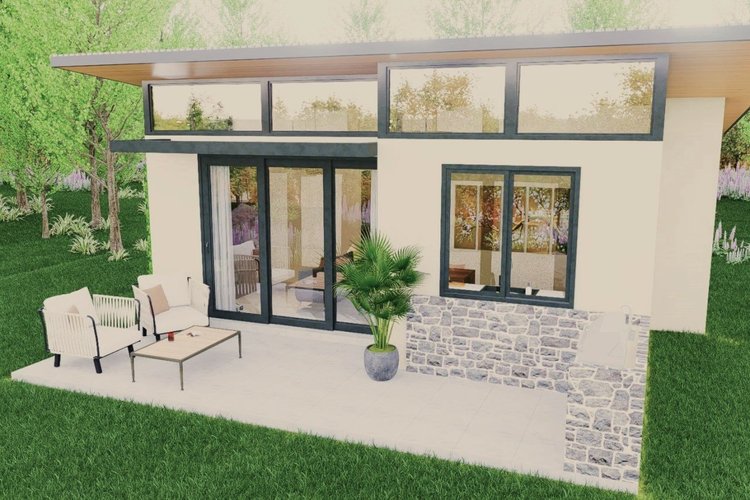 Modern house with a patio featuring outdoor furniture, potted plant, large sliding glass door, and a window, surrounded by green lawn and trees.