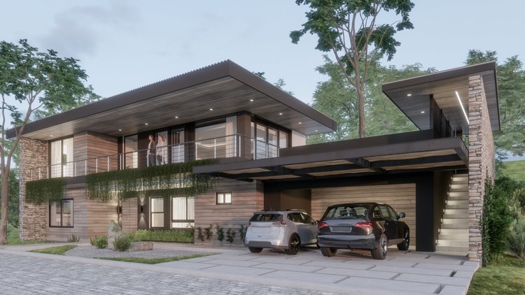 Modern two-story house with a flat roof, stone and wood exterior, large windows, balcony with glass railing, surrounded by greenery and trees, with a parking area featuring two cars.