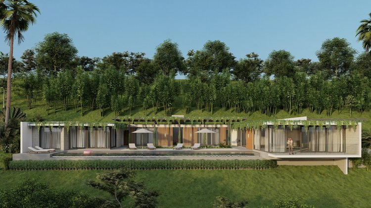 Modern house with large glass windows, outdoor lounge chairs, umbrellas, and a swimming pool, set in a lush green hilly landscape with trees and greenery.