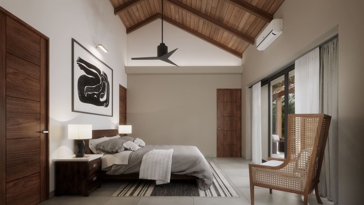 A modern bedroom with a wooden ceiling, a large bed with gray and white bedding, two nightstands with lamps, a black and white abstract art piece on the wall, a wooden door, a wooden armchair, a sliding glass door with white curtains, and outdoor fur